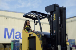 Staff drives forklift