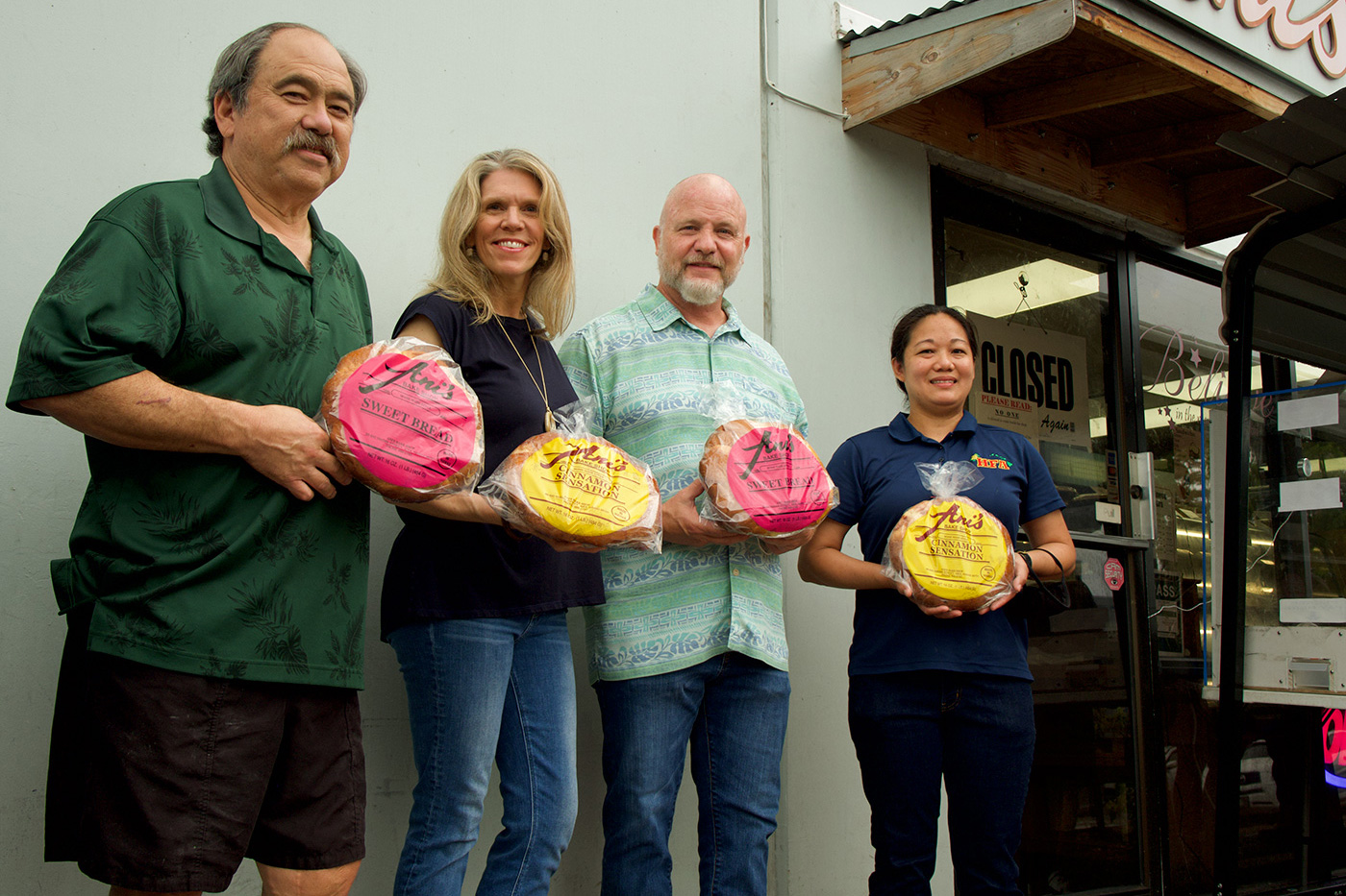 HFA employees and Ani's Bakeshop owner posing with fresh baked bread.